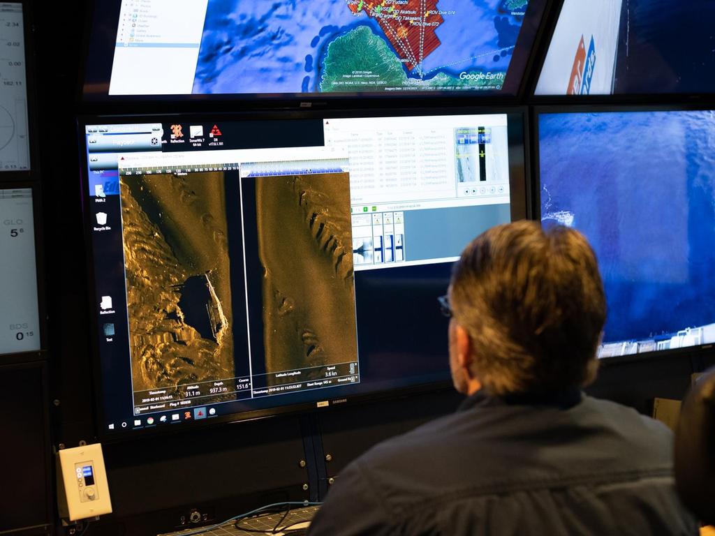 A researcher looking through the AUV sonar data of Hiei. Picture: R/V Petrel 