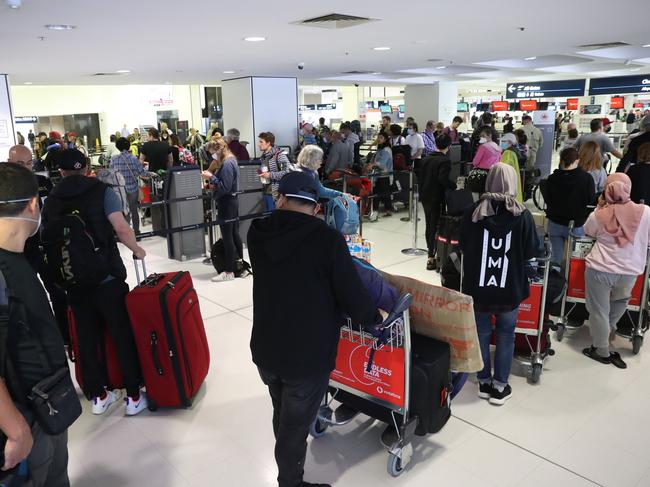 Passengers trying to get onto flights out of Australia at Sydney international airport. picture John Grainger