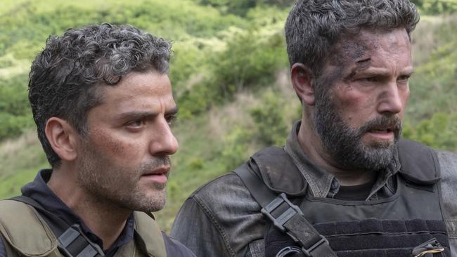 This image released by Netflix, shows Oscar Isaac, left and Ben Affleck in a scene from the film, 