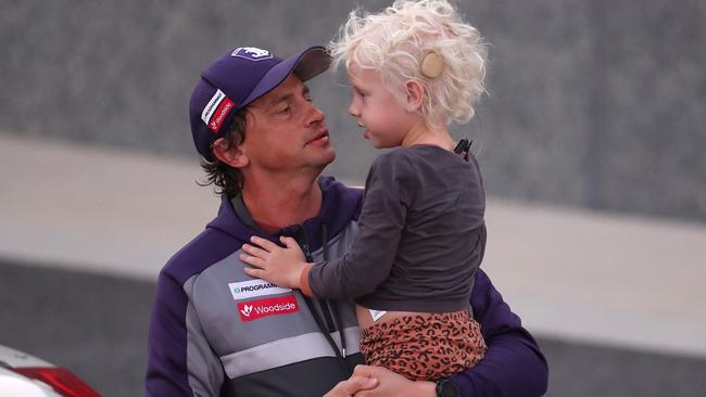 Assistant Fremantle coach Marc Webb with his child. Picture: Getty Images