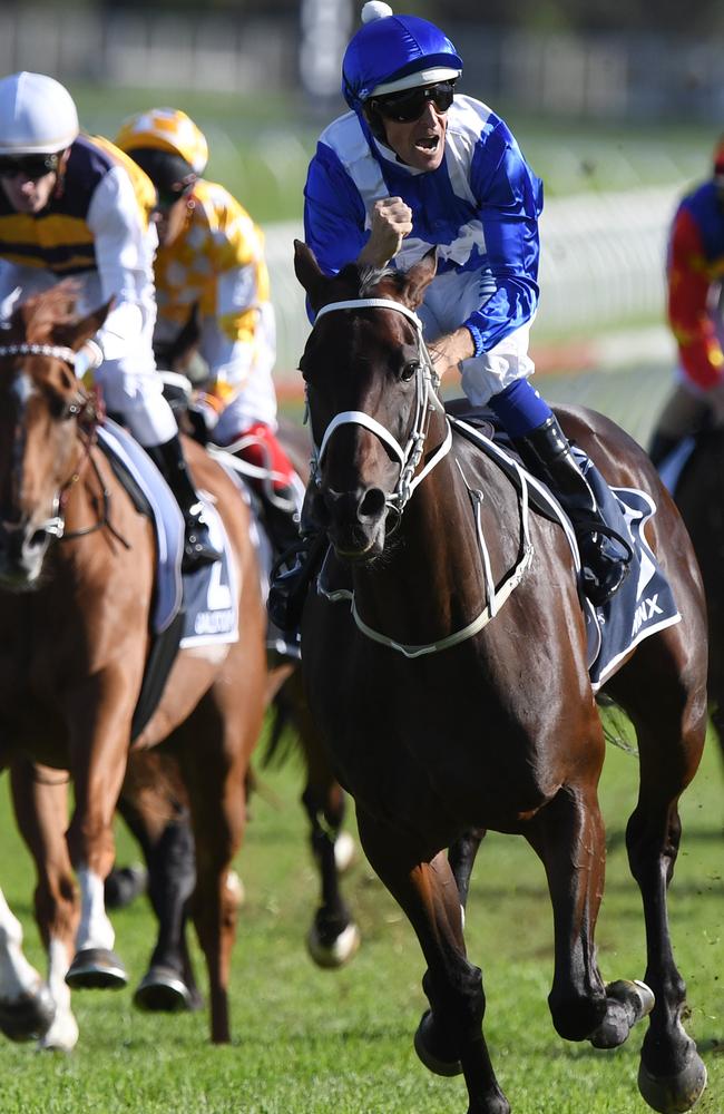 Jockey Hugh Bowman gestures to the crowd as the champion mare equals Black Caviar’s amazing record of 25 consecutive wins. Picture: AAP