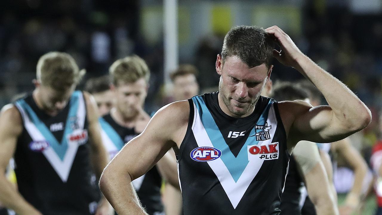  Brad Ebert scratches his head as he walks off with the team after the loss. Picture: SARAH REED