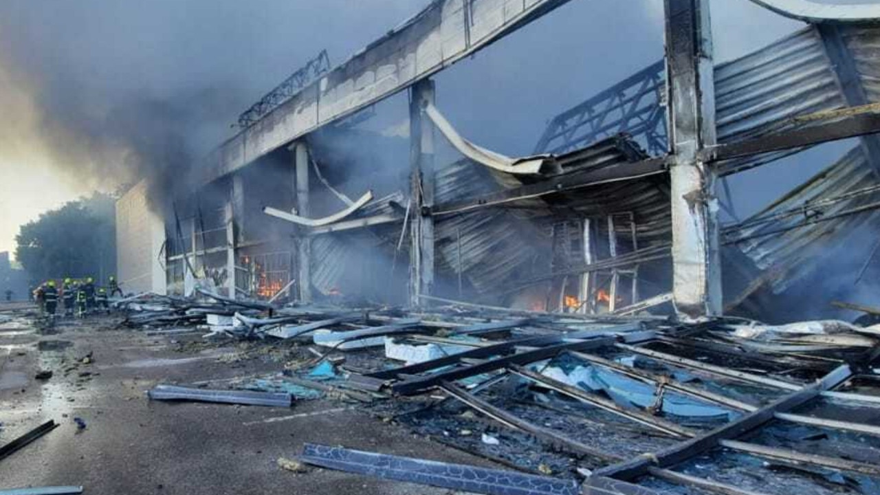 Ukrainian firefighter extinguish a fire caused by Russian attacks on the shopping centre in Kremenchuk, Poltava region. Picture: Ukrainian State Emergency Service / Handout/Anadolu Agency via Getty Images