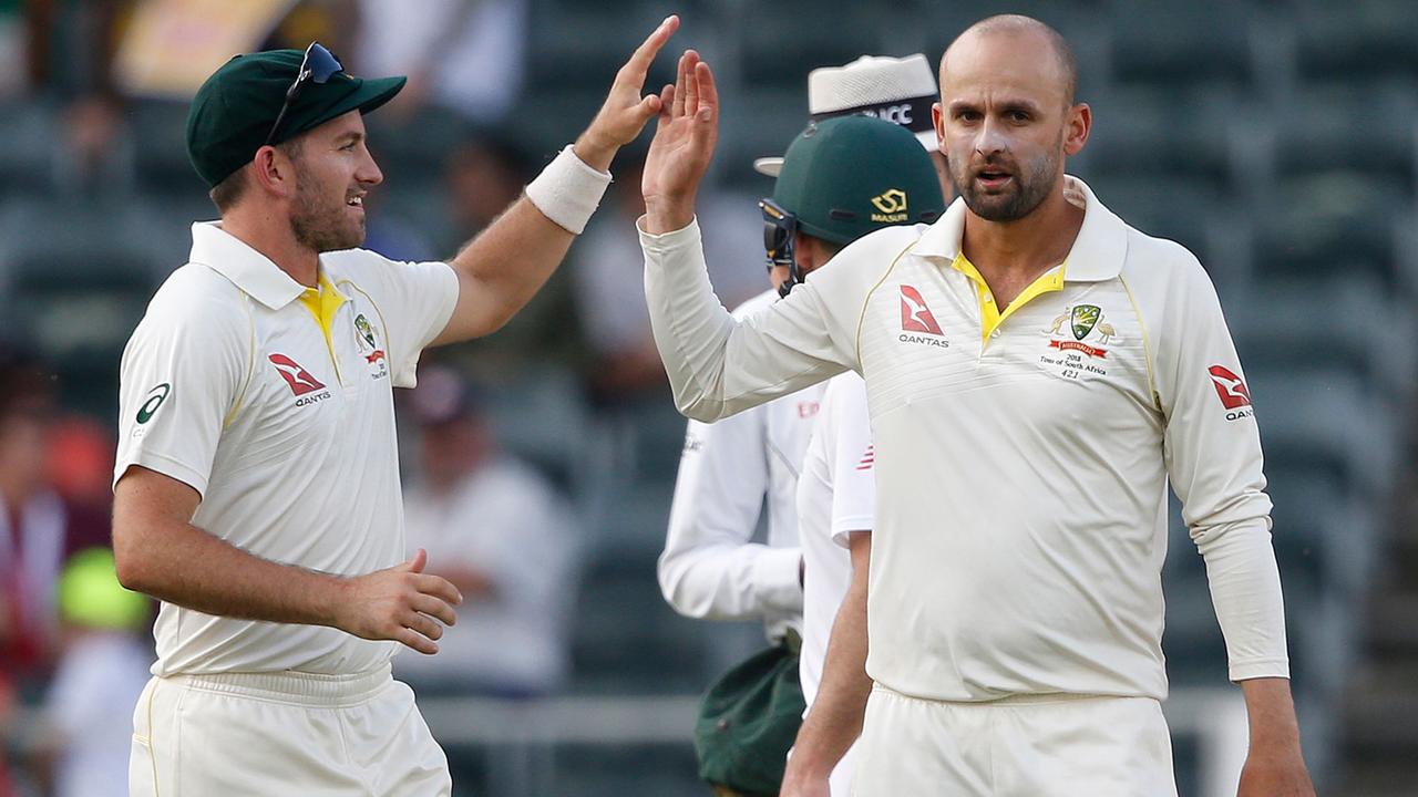 Nathan Lyon is congratulated by Chadd Sayers after taking a wicket.