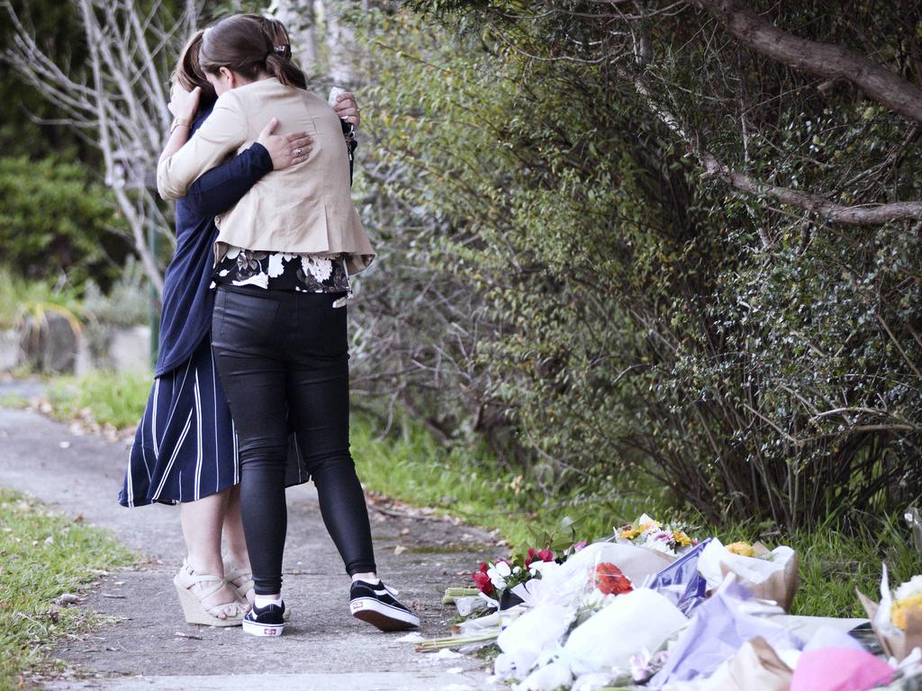 Locals comfort each other after John Edwards shot his children dead in West Pennant Hills. Picture: Flavio Brancaleone