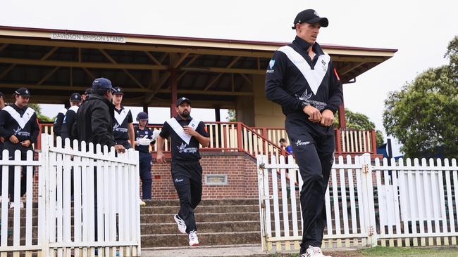 Josh Clarke leads his team out in a Kingsgrove Sports T20 Cup.