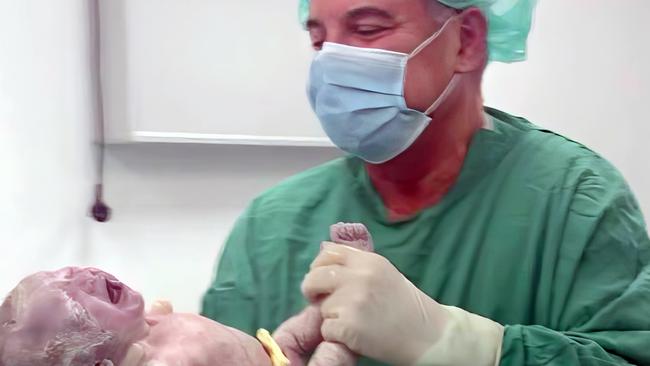 The founder of the Mediterranean Fertility Institute, Dr Ioannis Giakoumakis, with a newborn. Picture: Facebook