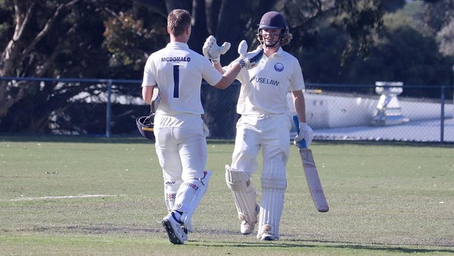 Josh McDonald and Lachie Field come together after McDonald's 100 against Fitzroy Doncaster. Picture: Carey Neate