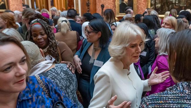 Queen Consort Camilla speaks with guests near Ngozi Fulani, back left, chief executive of the London-based Sistah Space group, during a reception to raise awareness of violence against women and girls at Buckingham Palace early in the week. Picture: Pool / AFP