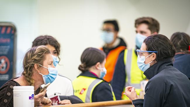 Arrivals into Hobart Airport going through COVID screening procedures with Biosecurity Tasmania. Picture: MATHEW FARRELL