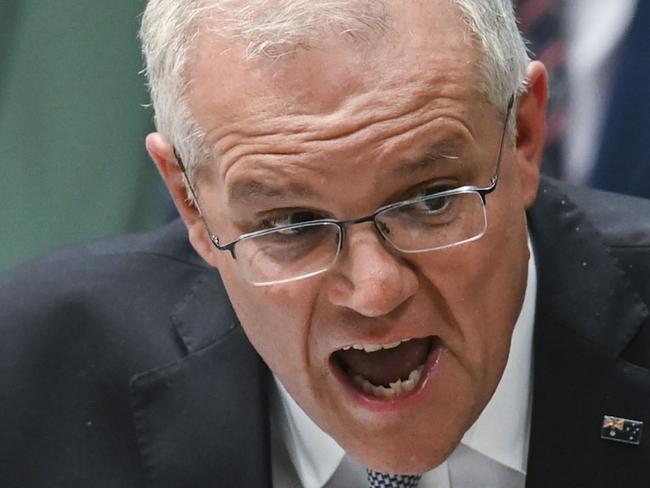 CANBERRA, AUSTRALIA - MARCH 30: Australian Prime Minister Scott Morrison speaks during question time in the House of Representatives at Parliament House on March 30, 2022 in Canberra, Australia.  The Morrison government's fourth budget has a focus on mitigating the rising cost of living with fuel excise halved for six months, a one-off tax offset for low and middle income earners and a $250 one-off payment to pensioners, carers, veterans, job seekers, eligible self-funded retirees and concession cardholders. Budget 2022-23 has also outlined billions of dollars of new spending for regional Australia, defence and infrastructure.