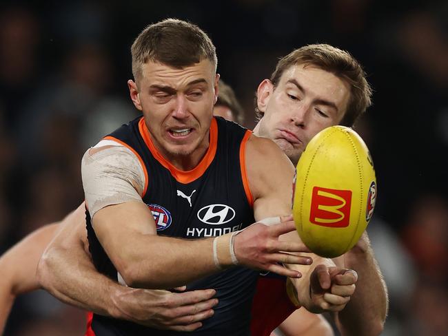 MELBOURNE. 05/05/2023. AFl.  Round 8. Carlton vs Brisbane Lions at Marvel Stadium. Patrick Cripps of the Blues clears as he is tackled by Harris Andrews of the Lions  . Pic: Michael Klein