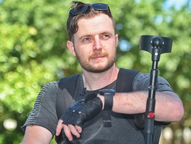 Patient Adam Woods can now walk with assistance using the robotic legs. Picture: Tony Gough