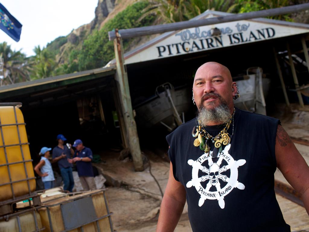 Pirate Pawl, one of the residents of the island, standing at the landing of the harbour. Picture: Alamy