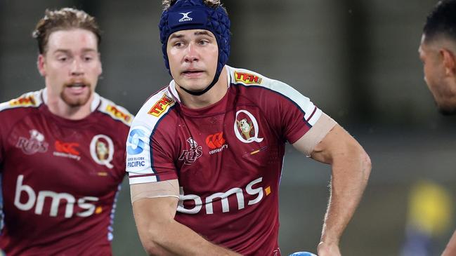 WHANGAREI, NEW ZEALAND - APRIL 12: Josh Flook of the Queensland Reds  looks to pass during the round eight Super Rugby Pacific match between Moana Pasifika and Queensland Reds at Semenoff Stadium, on April 12, 2024, in Whangarei, New Zealand. (Photo by Fiona Goodall/Getty Images)