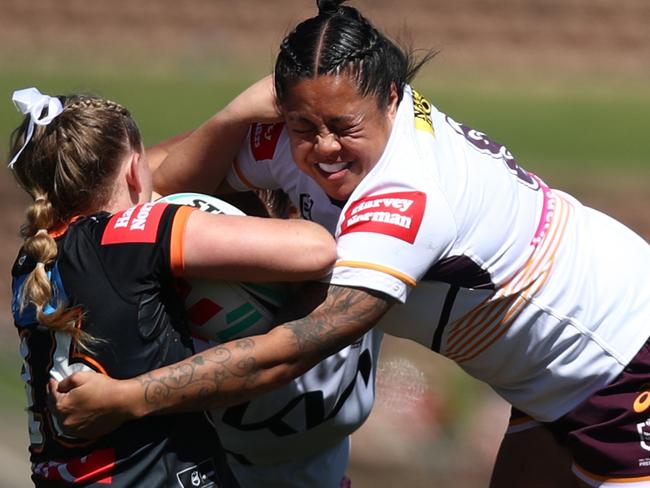 NEWCASTLE, AUSTRALIA - SEPTEMBER 09: Jessica Kennedy of the Wests Tigers is tackled by Annetta-Claudia Nu'uausala of the Broncos during the round eight NRLW match between Wests Tigers and Brisbane Broncos at McDonald Jones Stadium on September 09, 2023 in Newcastle, Australia. (Photo by Jason McCawley/Getty Images)