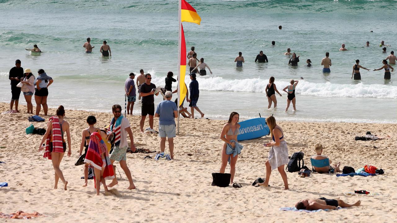 Beach-goers arrived at Bondi early pon Picture: NCA NewsWire / Damian Shaw