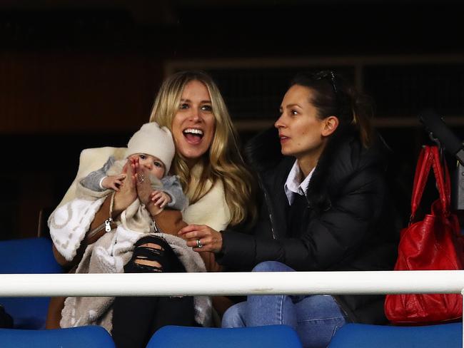 Clucky... Phoebe with sister Harriet and her baby at last night’s Souths game. Picture: Brett Costello