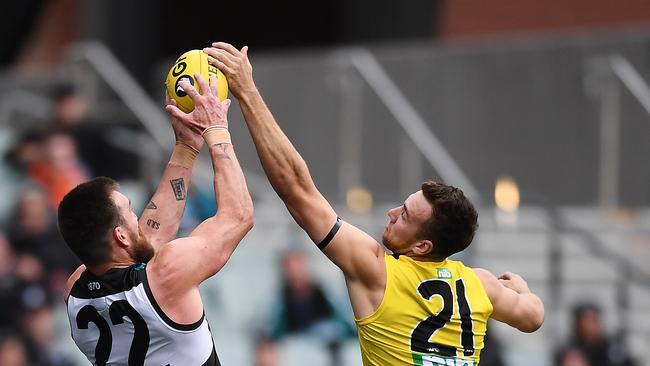 Port Adelaide forward Charlie Dixon marks strongly over Richmond’s Noah Balta.