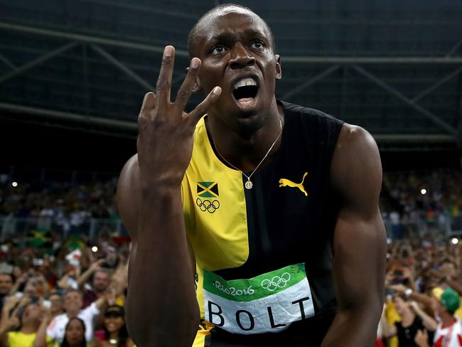 Usain Bolt celebrates the triple-triple.
