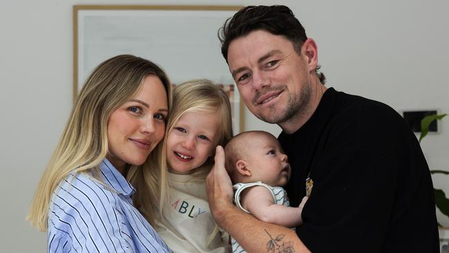 Lachie Neale pictured at home with his wife Jules and kids, Piper and baby Freddie. Picture: David Kelly