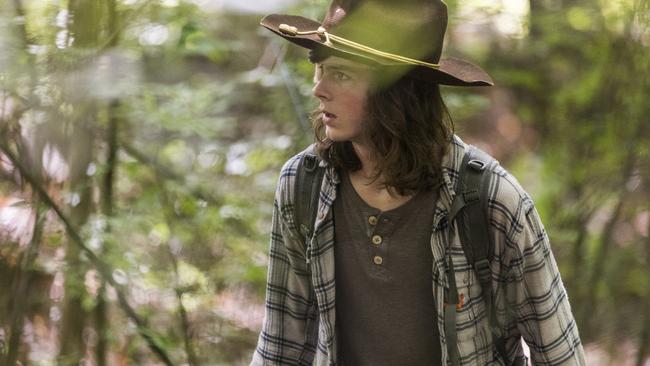 Carl Grimes heads into the forest wearing an old flannie shirt and some damn effective plot armour.