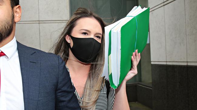 Monica Young leaving the JMT courts with her lawyer in Sydney. Picture: Adam Yip