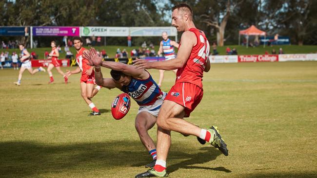 Bulldog's Luke Habel smothers the kick from Rooster's Billy Laurie, but it was all to no avail. Picture: Matt Loxton