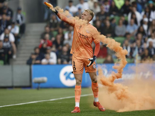 Melbourne City goalkeeper Tom Glover threw a flare back into the stands. Picture: Darrian Traynor