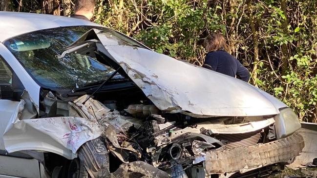 The driver of a Ford sedan had a lucky escape when his car collided with a school bus near Pomona on Tuesday morning. Pics: ABC