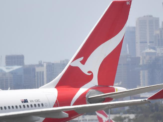 Qantas aircraft are seen at Sydney Airport, Thursday, 24 December 2020. Authorities are urgently investigating how a Qantas crew member contracted Covid-19 after arriving in Darwin from Paris and then flying to Sydney without being tested or quarantined. Federal health authorities are working with Qantas to understand how the man, who landed in Darwin on 17 December after working on a repatriation flight from Paris, became infected. Picture - Sam Mooy/The Australian Newspaper