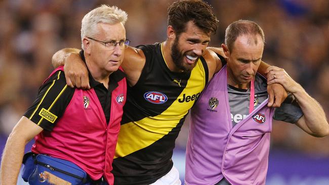 Alex Rance is helped off the ground in Round 1. Picture: Michael Klein