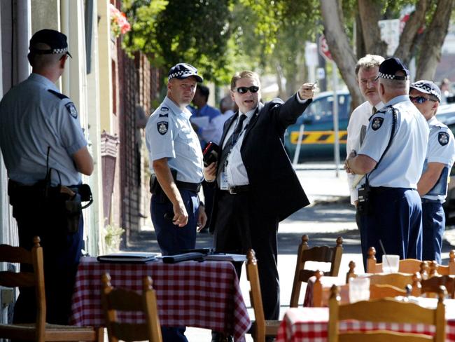 Police at the La Porcella restaurant where Veniamin was killed.