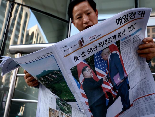 South Korea was reportedly surprised by Mr Trump’s vow to cease military exercises on the Peninsula. Pictured, a man reads a newspaper in Seoul. Picture: Chung Sung-Jun/Getty Images