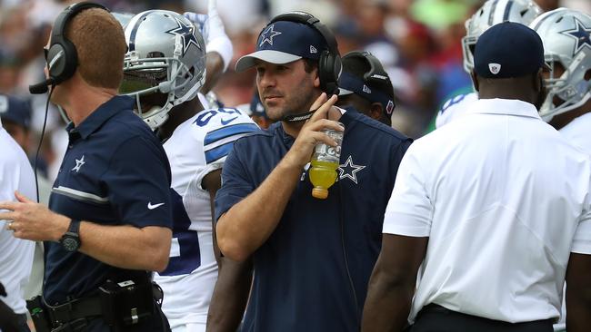 Quarterback Tony Romo #9 of the Dallas Cowboys looks on from the sideline against the Washington.