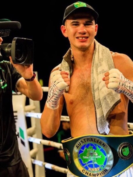 Reagan Dessaix and his title belt.