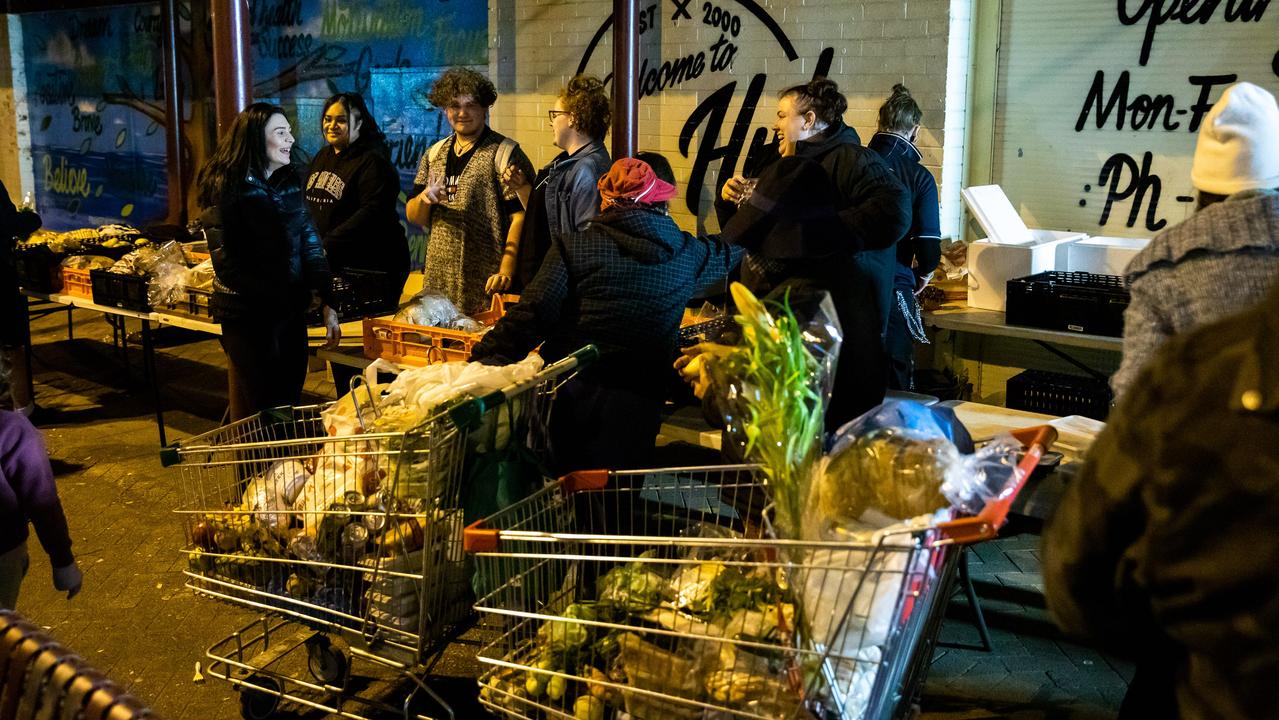 People queue for grocery items at a food bank run by Community Cafe in NSW. Picture: Media Mode/news.com.au