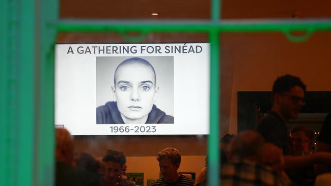 Fans attend a service for O’Connor at an Irish community centre in London.