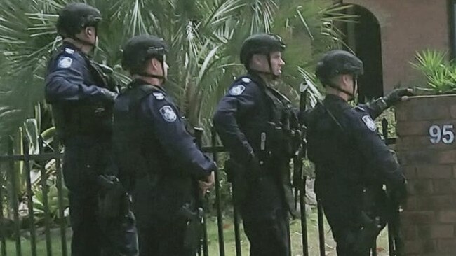 Heavily armed police at Bribie Island, Queensland, on Thursday. Picture: Rohmana Thompson