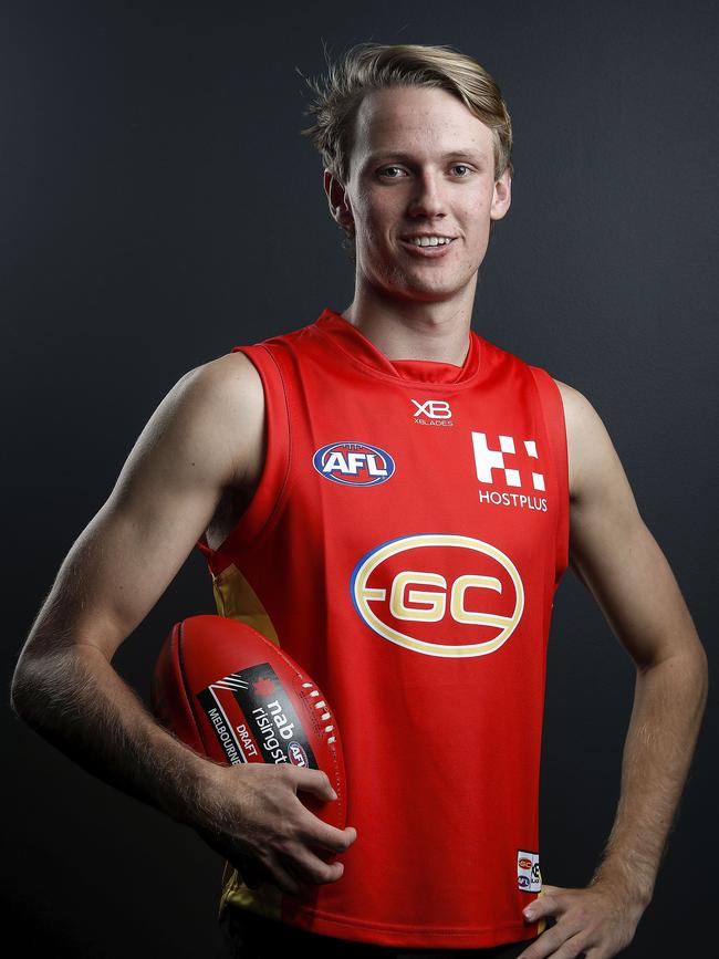 Gold Coast No.1 man Jack Lukosius in the Sun’s guernsey at the 2018 NAB AFL Draft at Marvel Stadium. Picture: Dylan Burns/Getty