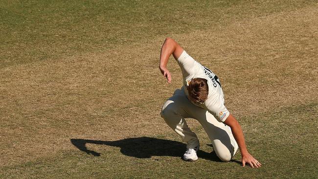 Cameron Green hits the Optus Stadium turf in frustration on day four. Picture: Cameron Spencer/Getty Images