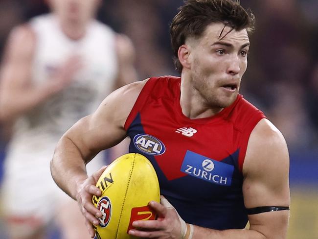 MELBOURNE, AUSTRALIA - AUGUST 13: Jack Viney of the Demons runs with the ball during the round 22 AFL match between the Melbourne Demons and the Carlton Blues at Melbourne Cricket Ground on August 13, 2022 in Melbourne, Australia. (Photo by Darrian Traynor/Getty Images)