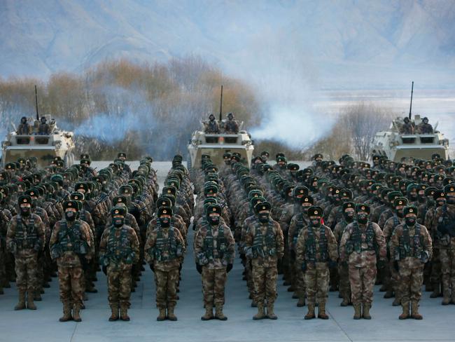 TOPSHOT - This photo taken on January 4, 2021 shows Chinese People's Liberation Army (PLA) soldiers assembling during military training at Pamir Mountains in Kashgar, northwestern China's Xinjiang region. (Photo by STR / AFP) / China OUT