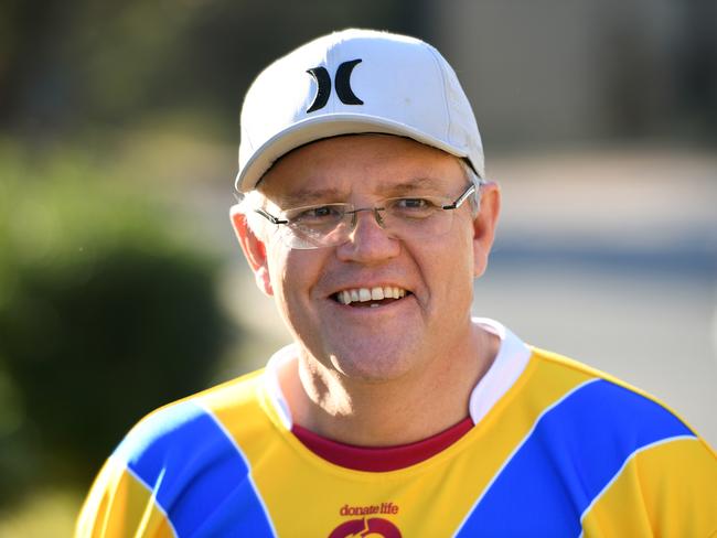 Daggy dad ScoMo playing a bit of footy in the ’burbs. Picture: AAP