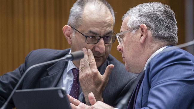 Mike Pezzullo, left, consults with Labor senator Murray Watt. Picture: Gary Ramage /NewsWire