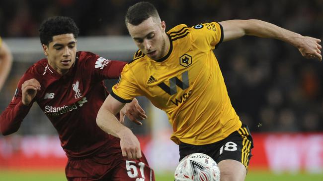 Ki-Jana Hoever, left, became the youngest Liverpool player in FA Cup history.