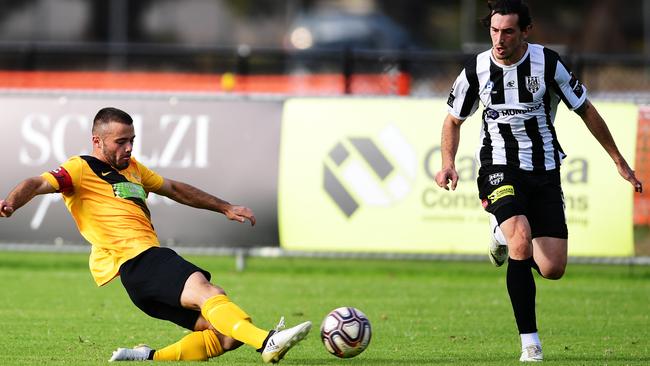 Elizabeth Vale’s James Greaves attempts to stop the ball during his side’s FFA Cup clash with Adelaide City on Saturday. Picture: AAP/Mark Brake