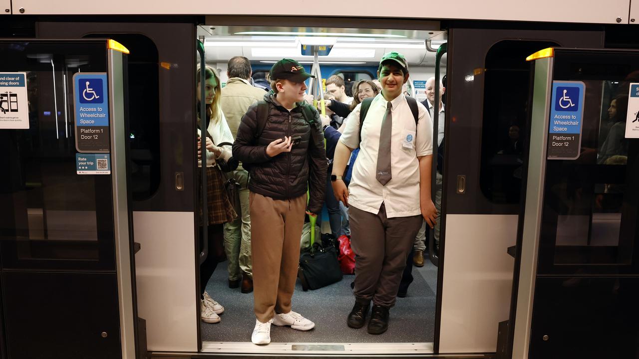 Pictured at Sydenham Station are among the first passengers on the brand new Sydney Metro on its maiden run to Tallawong at 4.54am. Picture: Richard Dobson