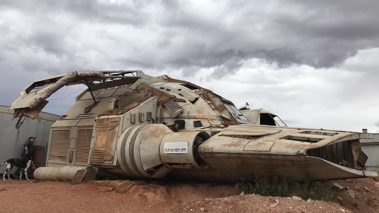 Coober Pedy's iconic spaceship is parked out front at The Oval Cave. Picture: Lydia Kellner