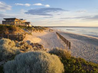 Melbourne, Australia - November 17, 2017: Carrum Beach in southeast Melbourne, close to sunset. The building is the Carrum Surf Life Saving Club.